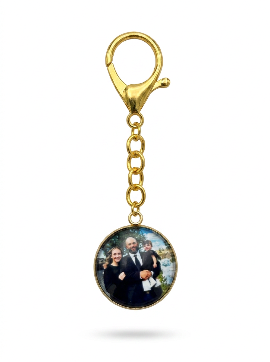 Round gold photo keychain with a family photo
